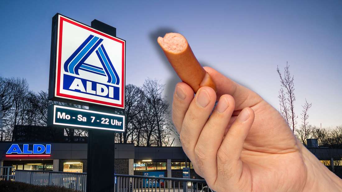 Qualcuno con in mano un hot dog, con Aldi sullo sfondo.